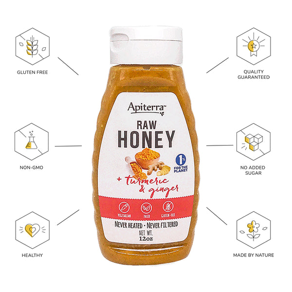 A jar of twelve ounces apiterra turmeric and ginger raw honey
